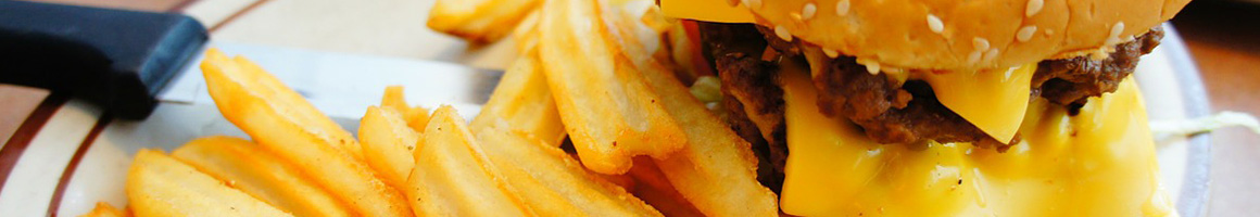 Eating American (Traditional) Burger Hot Dog at Ben's Chili Bowl restaurant in Washington, DC.
